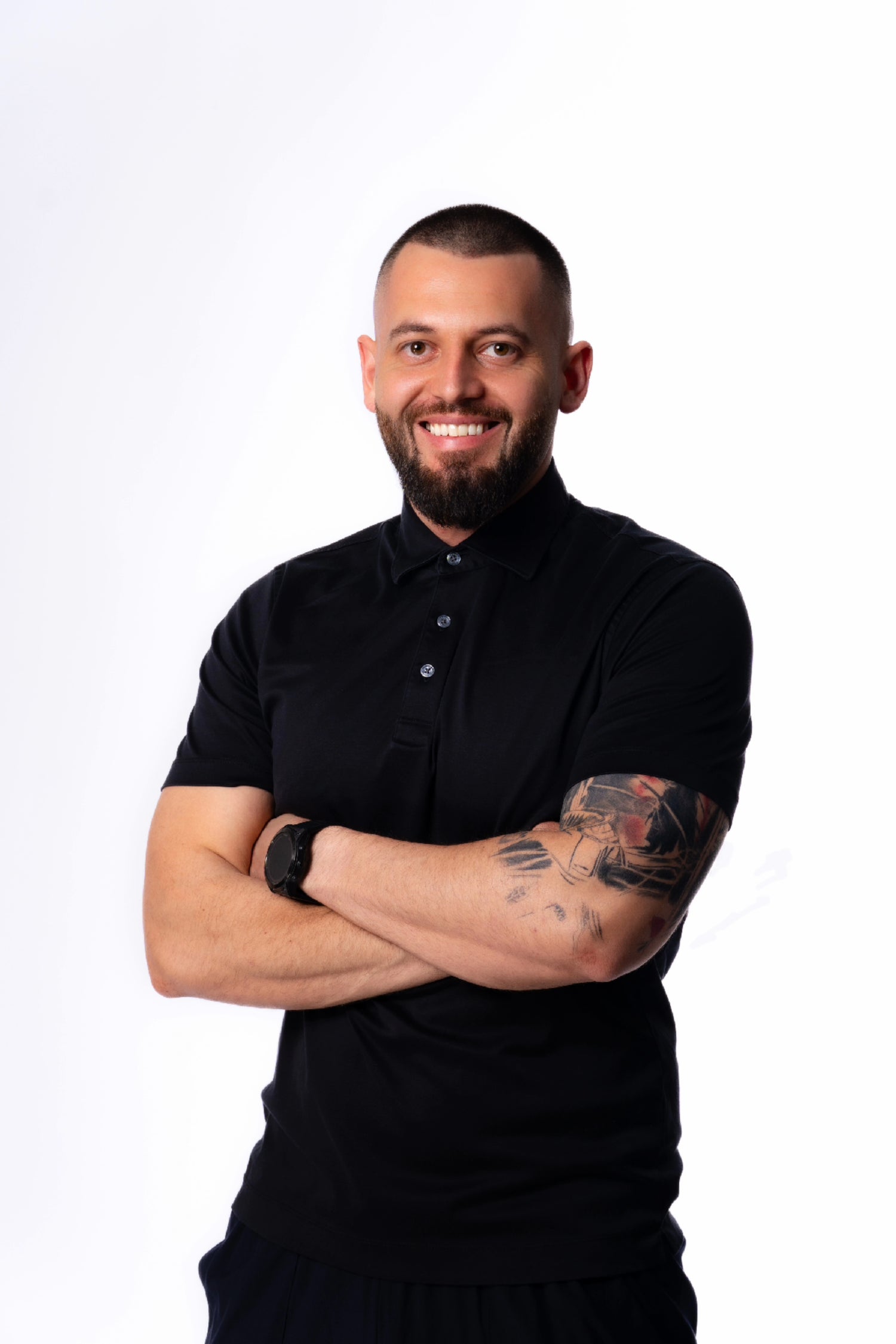 man black polo crossed arms